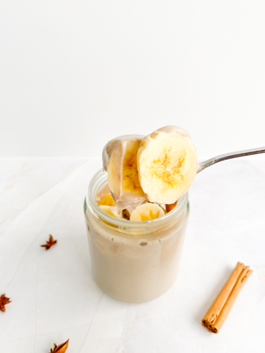 Vegan Sugar-free Caramel Pudding in a jar with sliced bananas on top