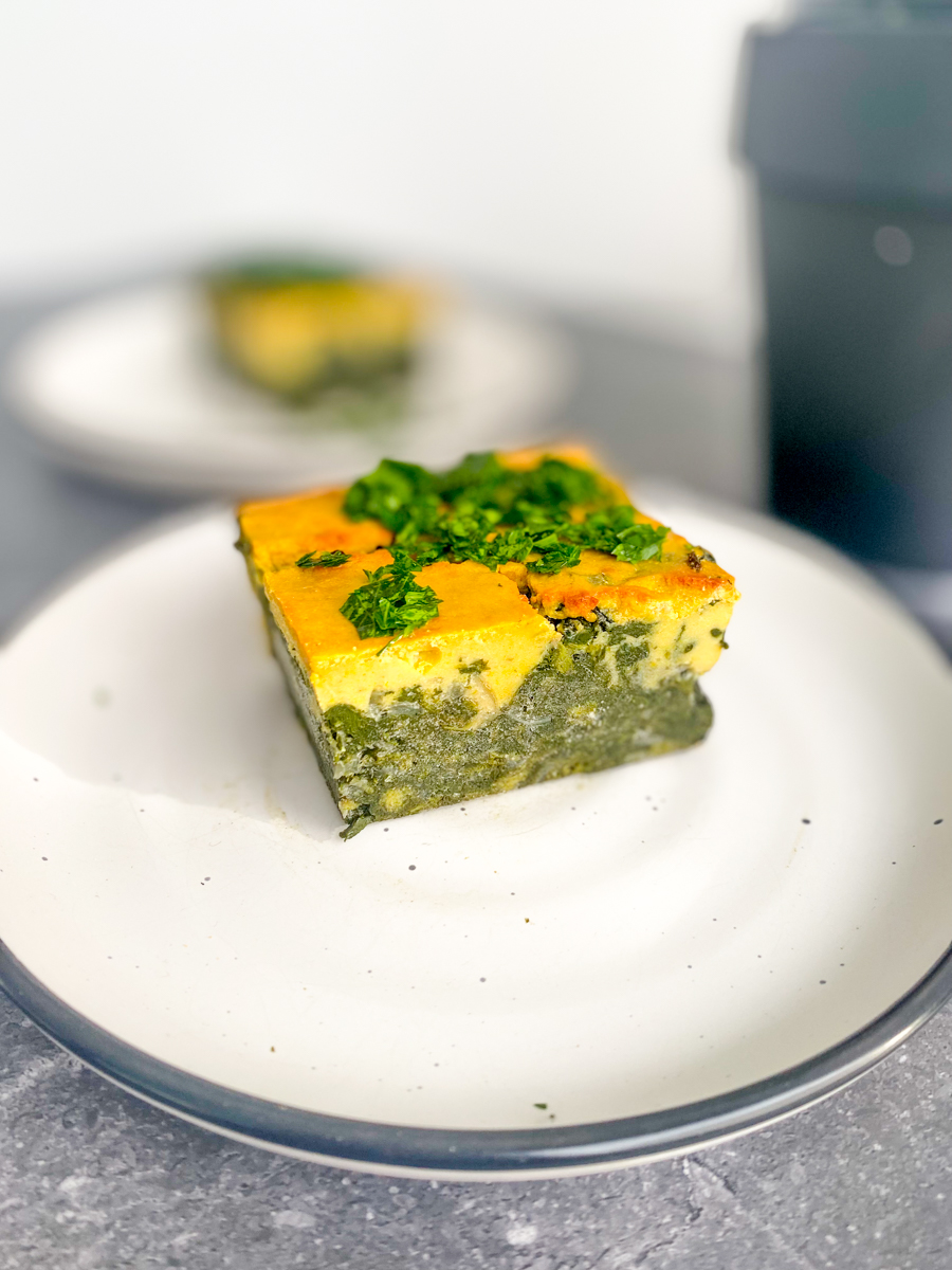 Slice of Vegan Spinach Frittata on two plates